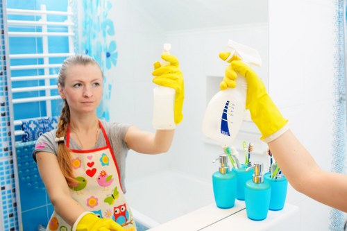 Technician using eco-conscious carpet cleaning equipment in Kentishtown